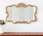 Homeroots - 27" Gold Ornate Scroll Framed Accent Mirror