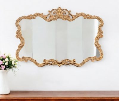 Homeroots - 27" Gold Ornate Scroll Framed Accent Mirror
