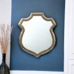 Homeroots - 24" Distressed Metallic Crest Shape Wall Mounted Accent Mirror Framed