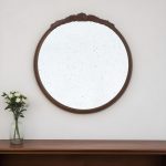 Homeroots - 30" Brown Crowned Top Antiqued Glass Framed Accent Mirror