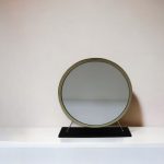 Homeroots - 19" Brass Round Metal Framed Freestanding Mirror