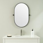 Homeroots - 32" Black Oval Iron Framed Bathroom Vanity Mirror
