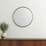 Homeroots - 36" Antiqued Gold Metal Round Framed Accent Mirror